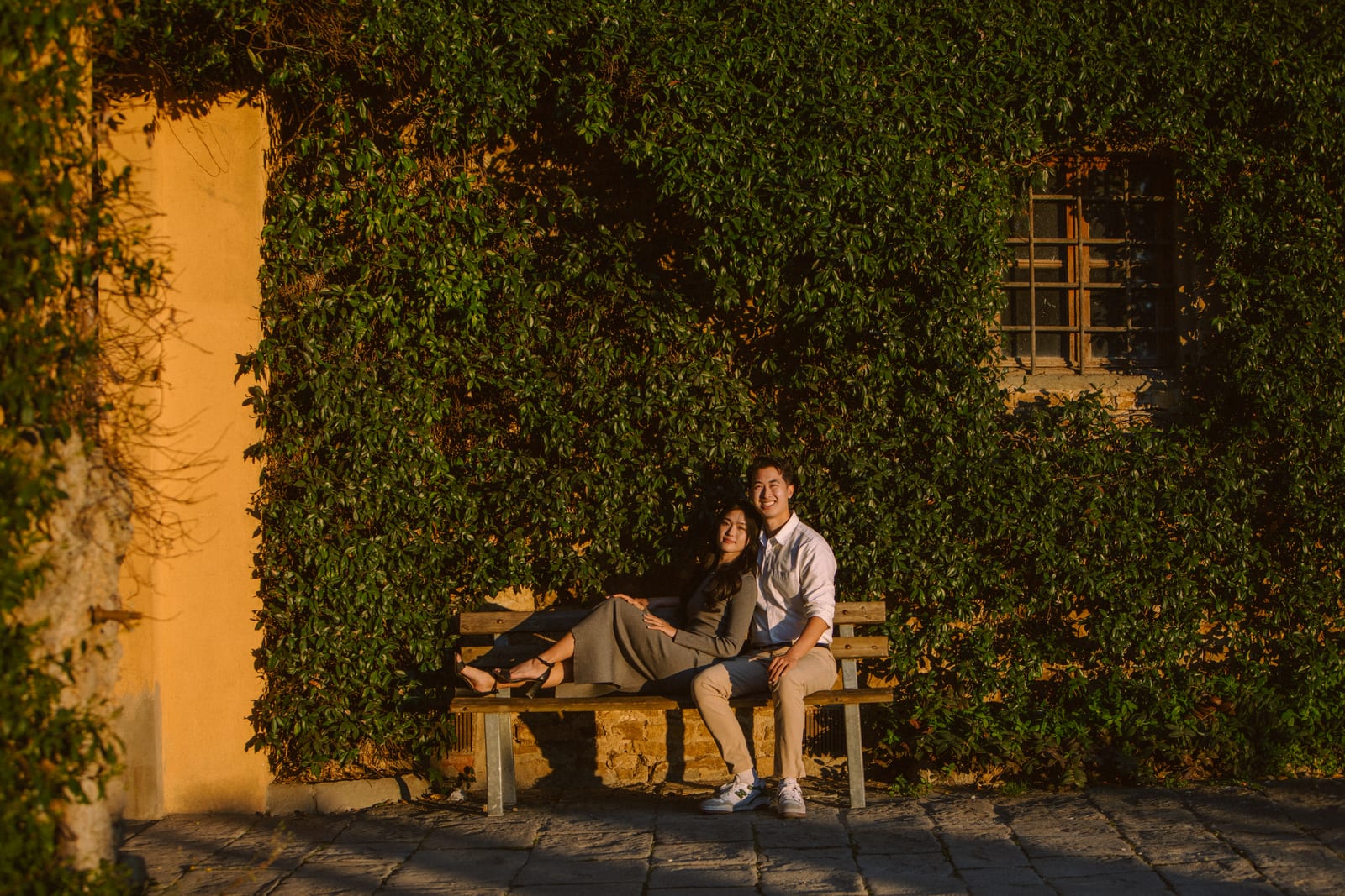 Couple sitting near Piazzale Michelangelo during golden hour