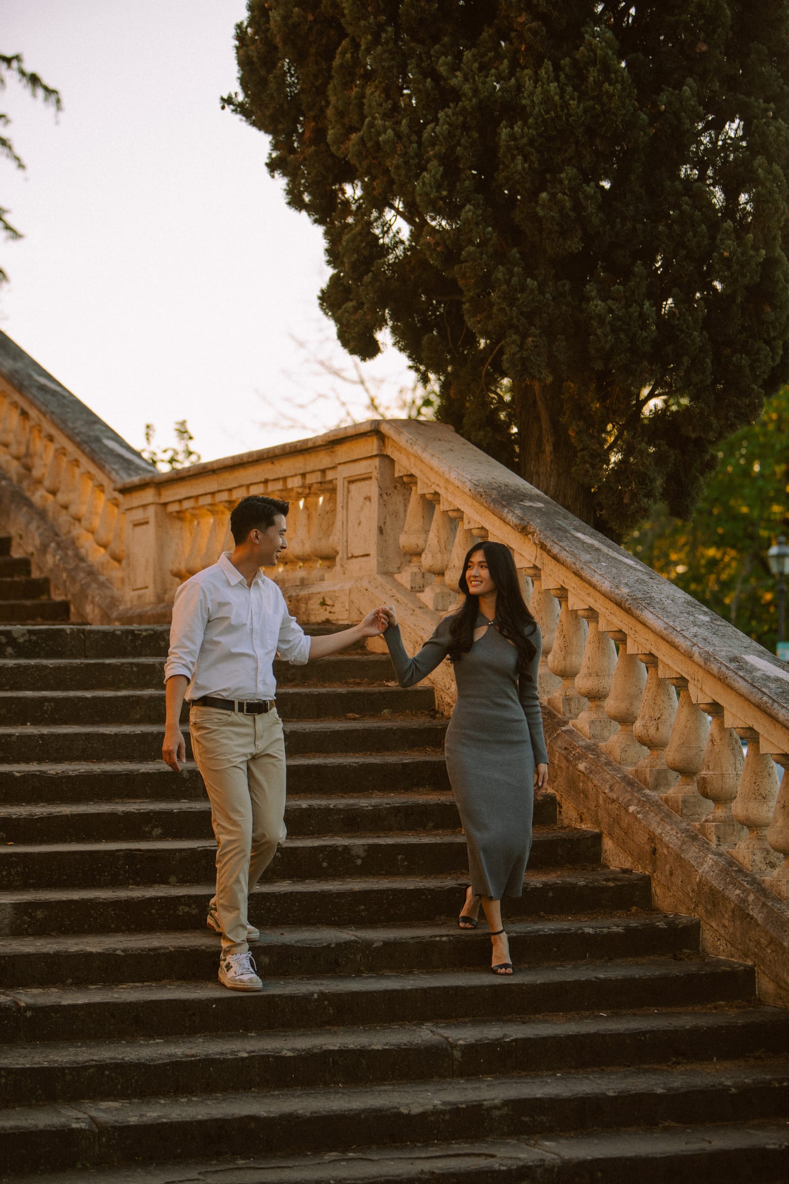 Couple walking on steps near Piazzale Michelangelo in Florence