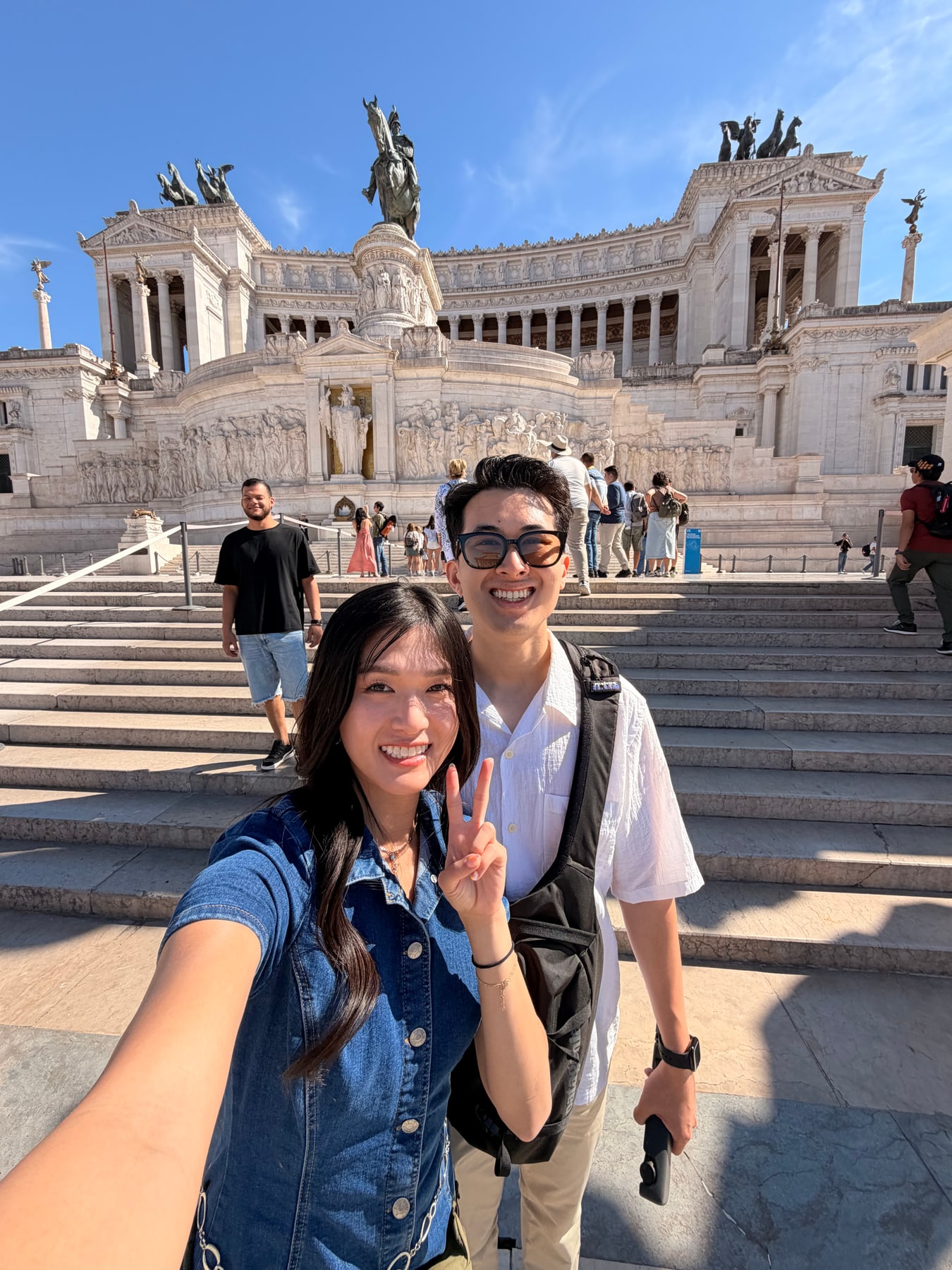 Travelers on the steps of the Altar of the Fatherland in Rome
