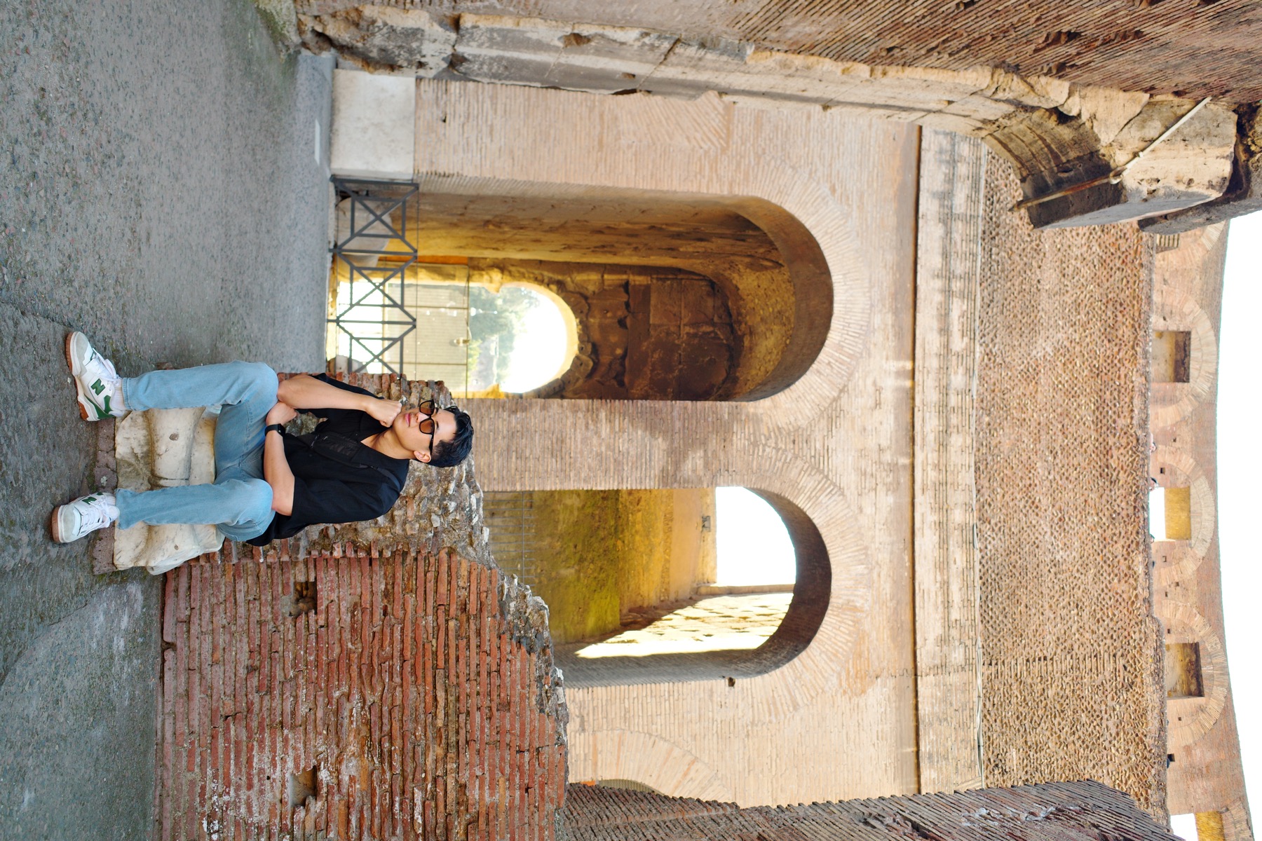 The Colosseum arena level with brick arches and ancient stonework