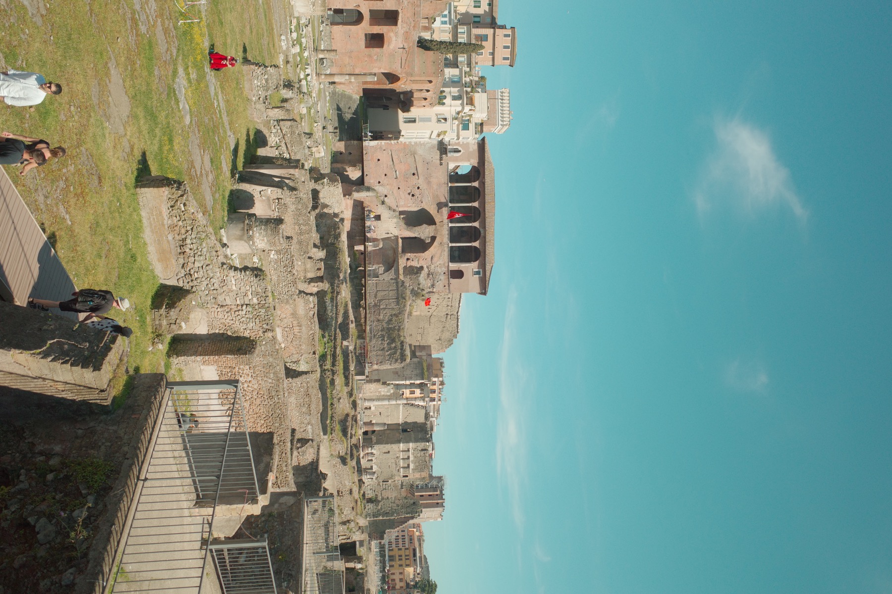 Roman Forum ruins and ancient brick walls under a blue sky