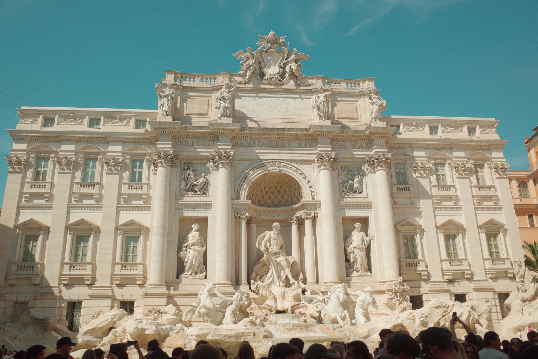 Trevi Fountain in Rome surrounded by daytime visitors