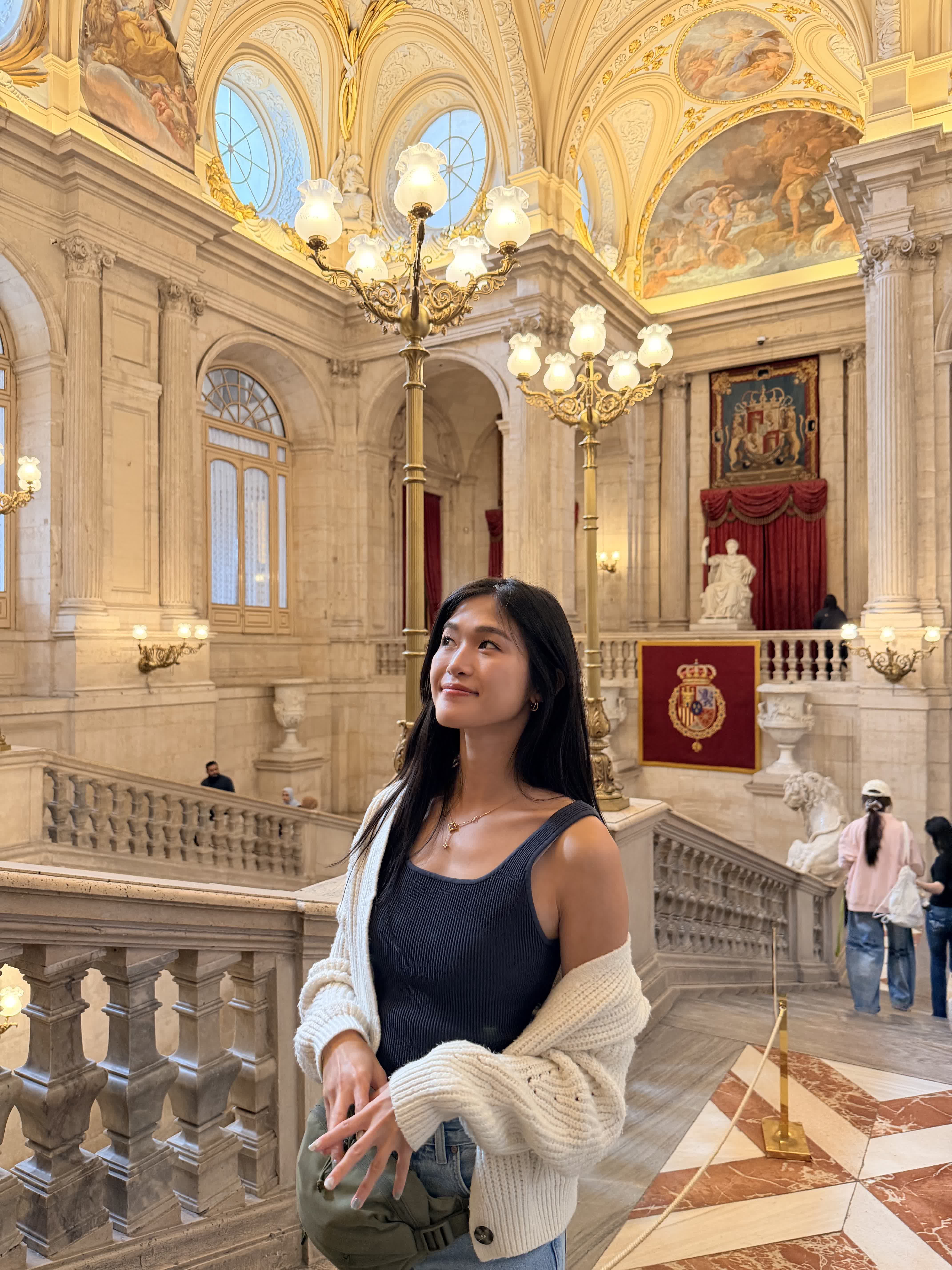 Standing on the Grand Staircase inside the Royal Palace of Madrid