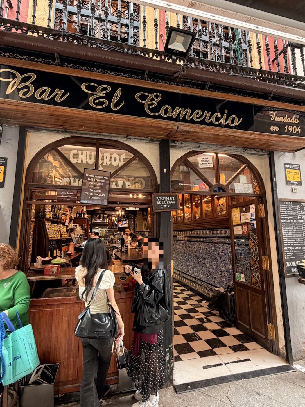 The storefront of Bar El Comercio in Seville, founded in 1904