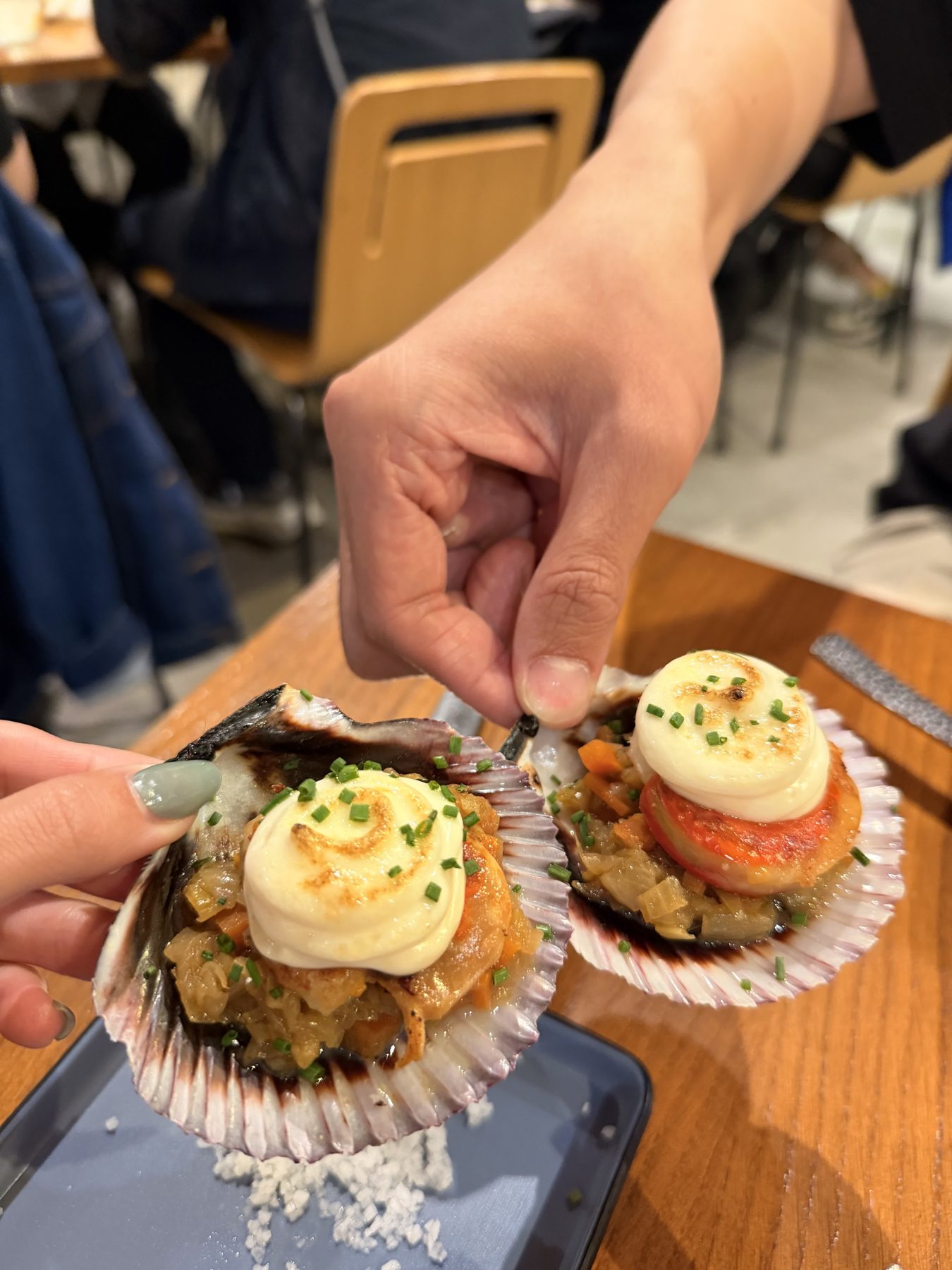 Scallops served in shells at El Pasaje in Seville