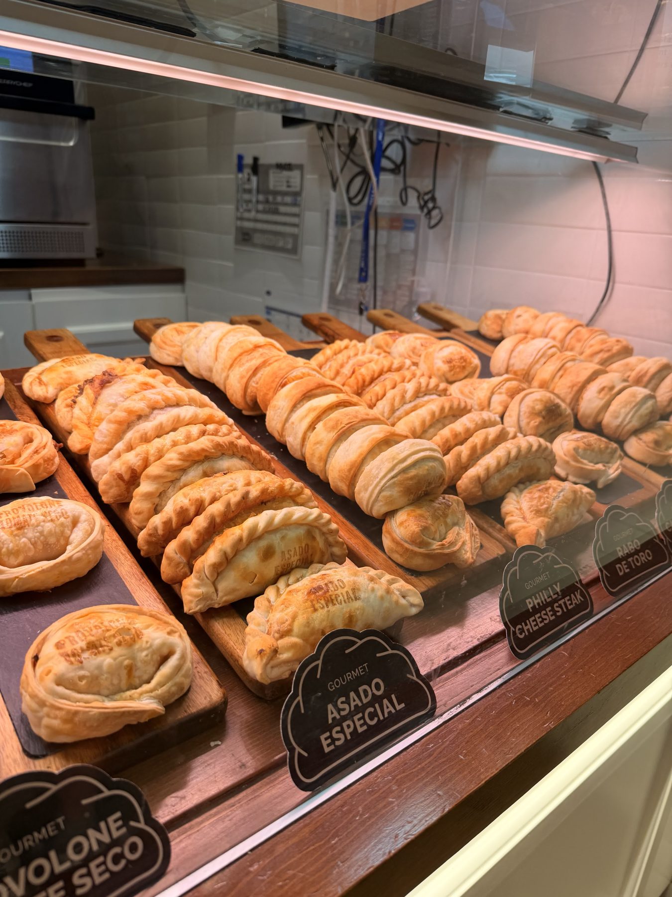 Empanadas on display at Empanadas Malvón in Seville