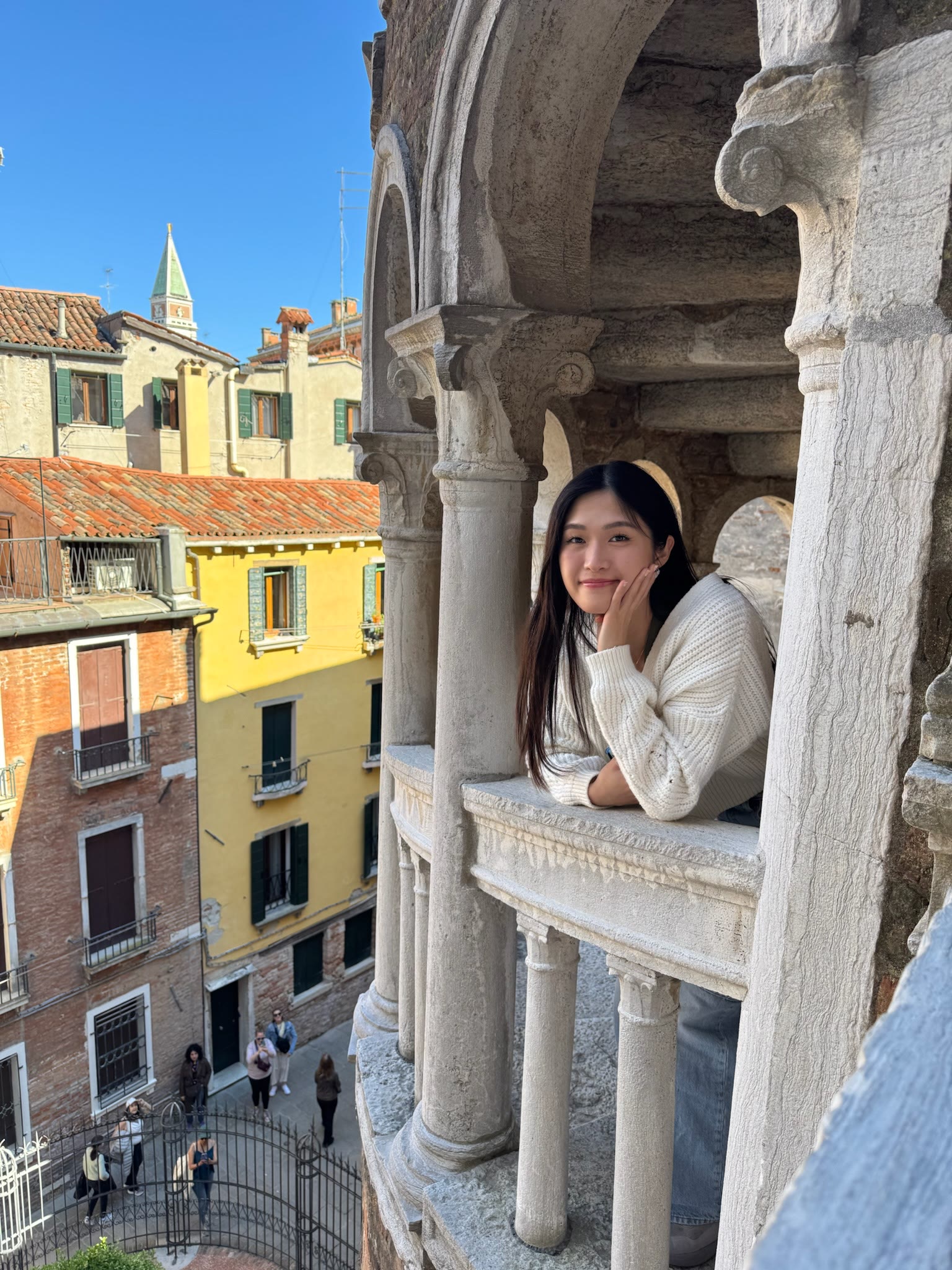 Portrait framed by the stone arches at Palazzo Contarini del Bovolo in Venice