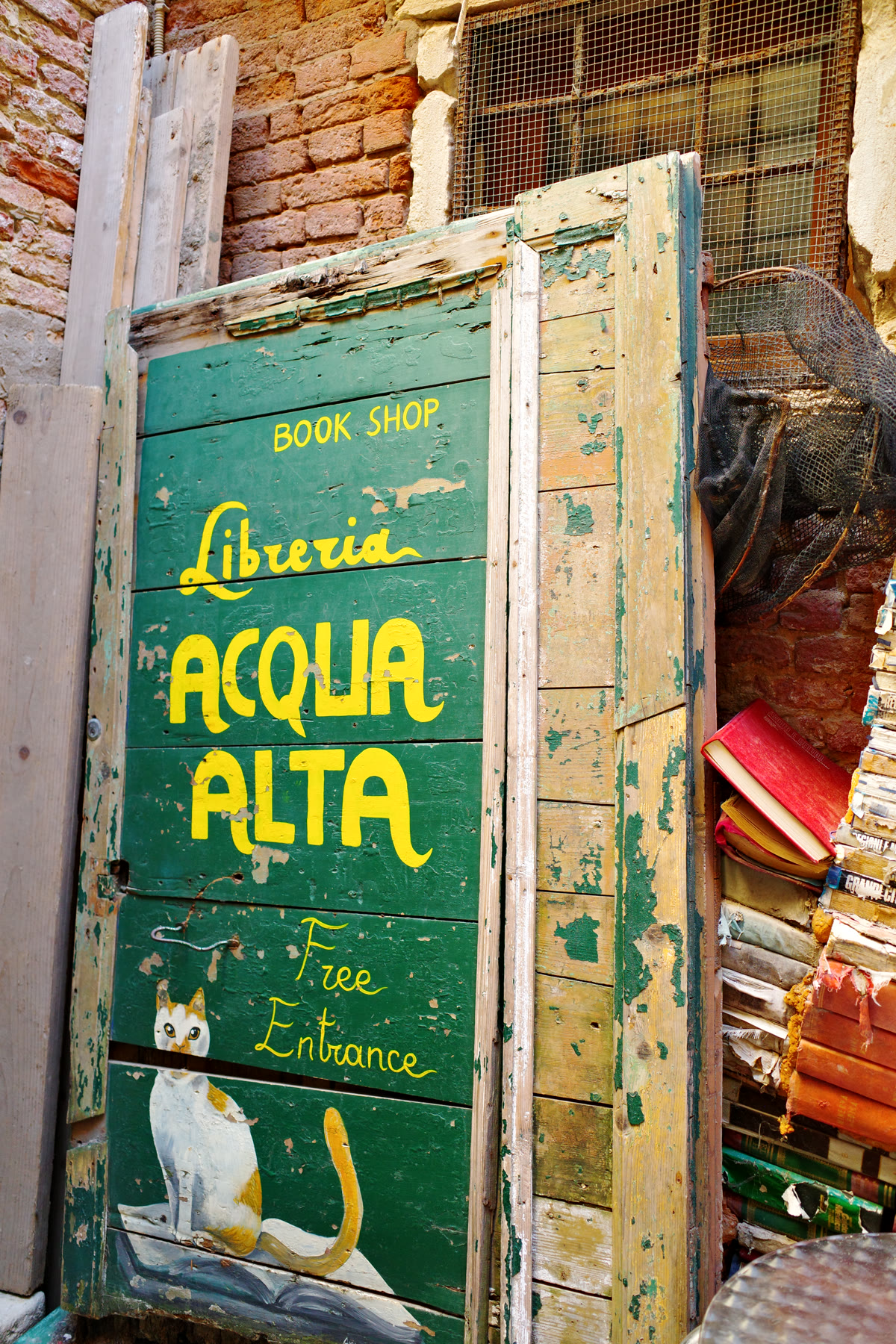 Hand-painted Libreria Acqua Alta bookshop sign in Venice